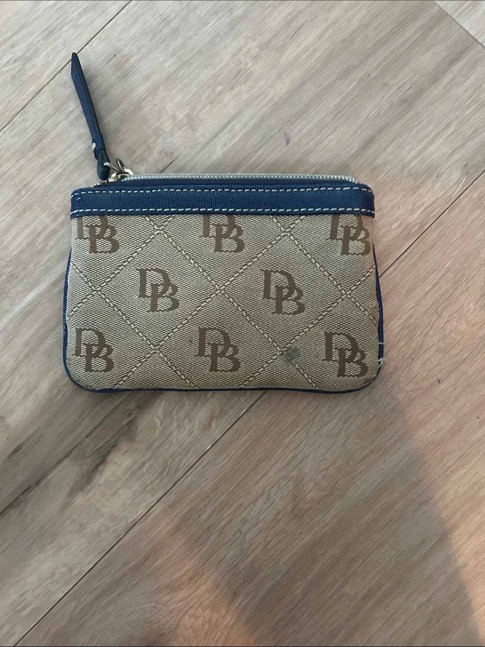 Dooney & Bourke Beige Canvas Wristlet with Navy Trim and Logo